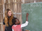 Volunteer with children in Mozambique