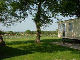 Looking  out over field towards the solent from a Holiday Caravan