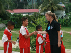 a volunteer with the Summer Camp children
