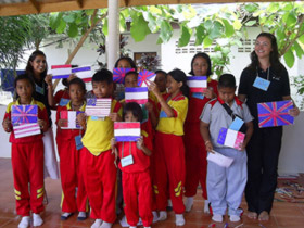 volunteers and children with their flags