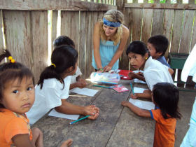Volunteer with children in Ecuador