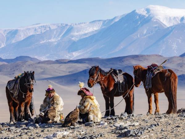 Horses and Mongolian People in Mongolian scenery mountains