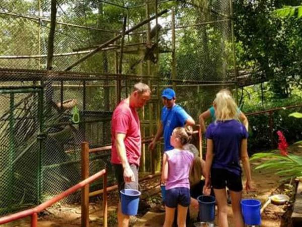 Family volunteering at wildlife rescue centre, Costa Rica