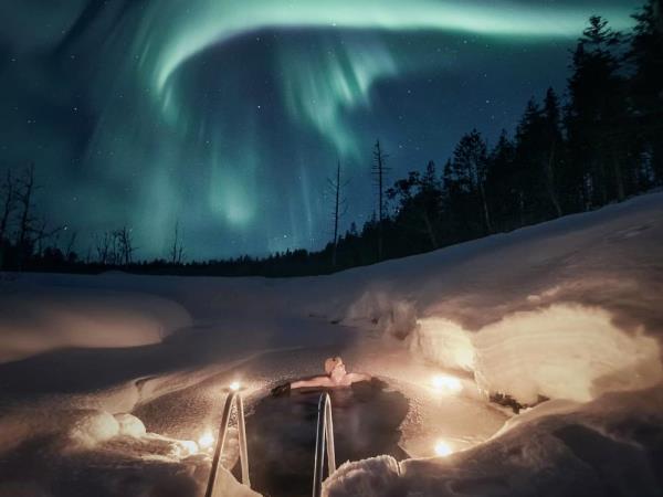 Northern Lights with snow hotel vacation