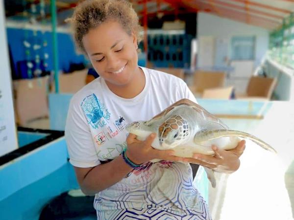 Family volunteering with turtles in the Maldives