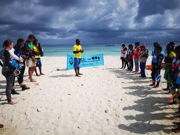 Family volunteering with turtles in the Maldives