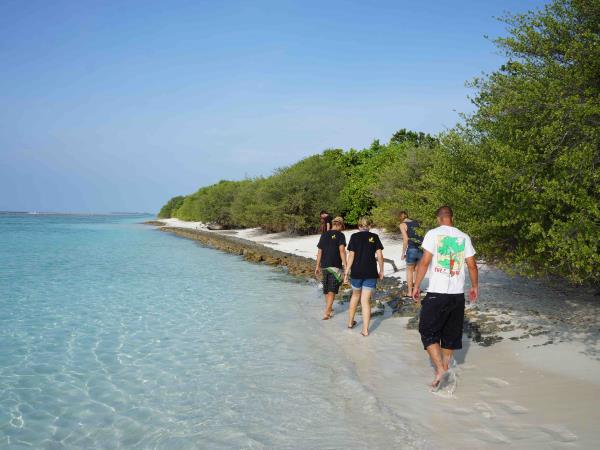 Family volunteering with turtles in the Maldives