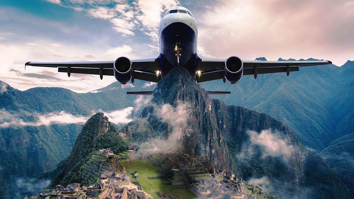 aeroplane looming over machu picchu casting a shadow