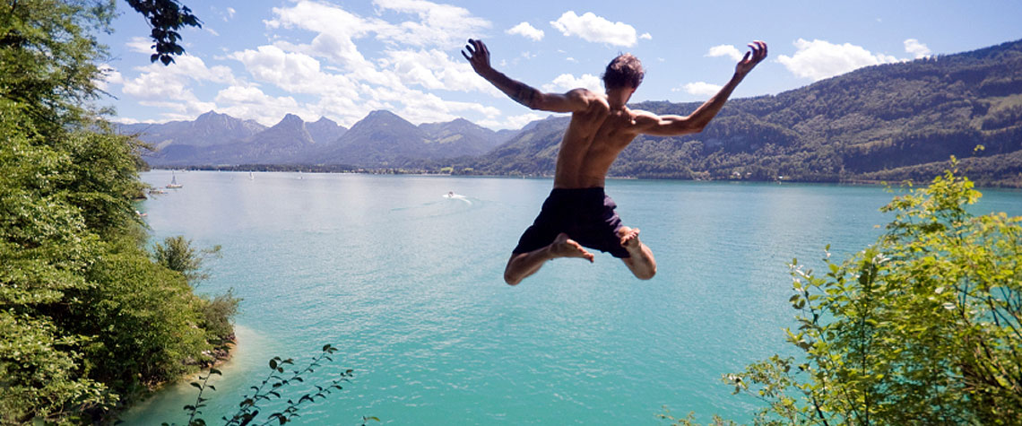 Man jumping into lake