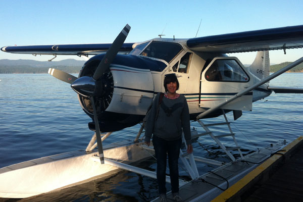 Catherine next to a float plane on Pender Island