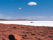 Driving over Eyre Lake, South Australia. South Australia Tourist Board
