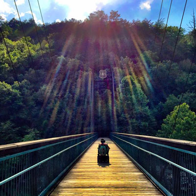 Cory crossing a bridge