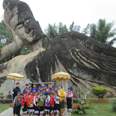 Group by a huge stone buddha