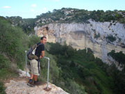 Walker looking out at ravine, Menorca. Photo from Audax Hotel