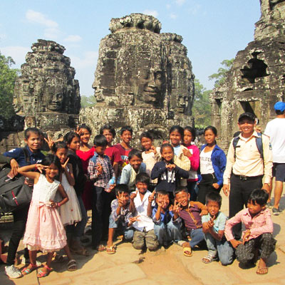 Group in front of stone ruins