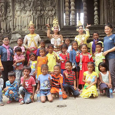 With ladies in traditional dress