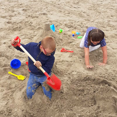 Children building sandcastles