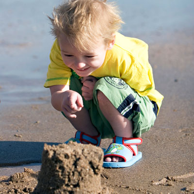 Boy with sandcastle