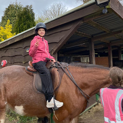 One of the children riding a horse