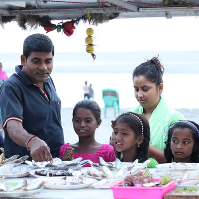 Looking at fish on a food stall