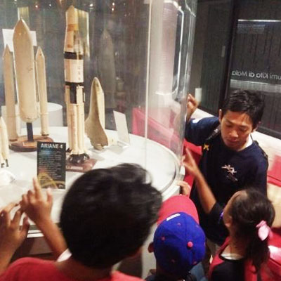 Children looking at rocket