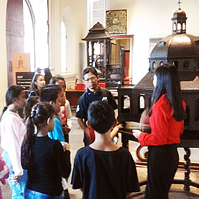 Children looking at artifacts