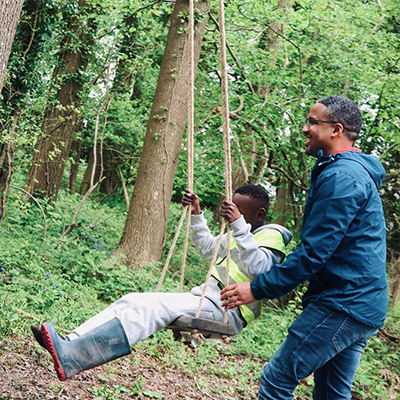 The children pose for a photo with their sticks.