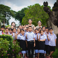 Happy children and buddha statues