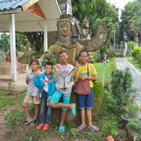 Group by a huge stone buddha