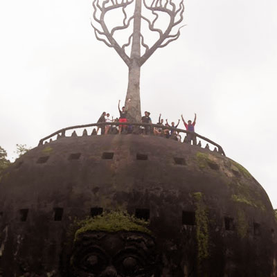 Children waving from top of monument