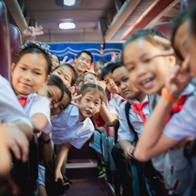 Children enjoying the bus journey