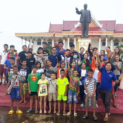 Group in front of statue