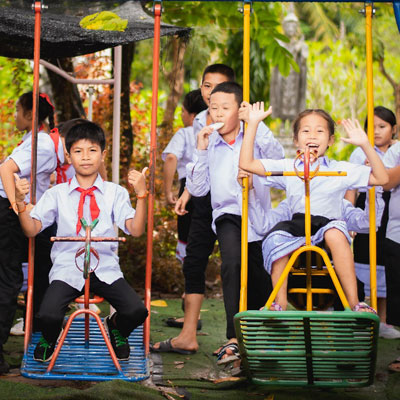 Children playing on swings