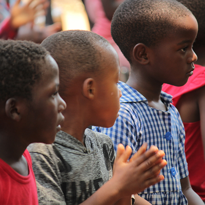 3 children watching the cultural show