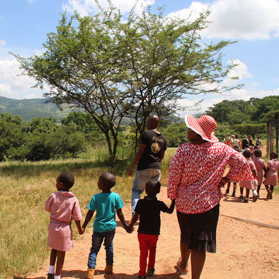 Children walking through the sanctuary