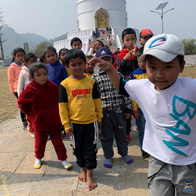 The kids running toward the camera