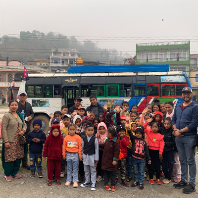 The kids posing by their transport