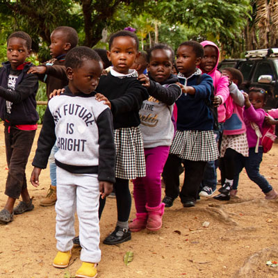 Children doing a conga line