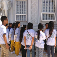 Youths listening to their guide