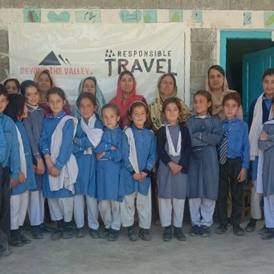 The group posing for a photo together with a Responsible Travel banner