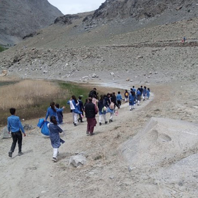 The kids walking down the valley trail