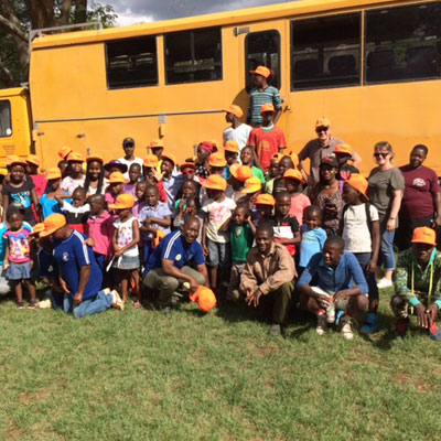 The group of kids by the truck