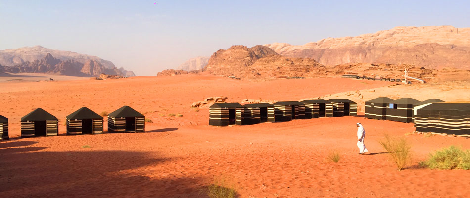Bedouin man crossing desert